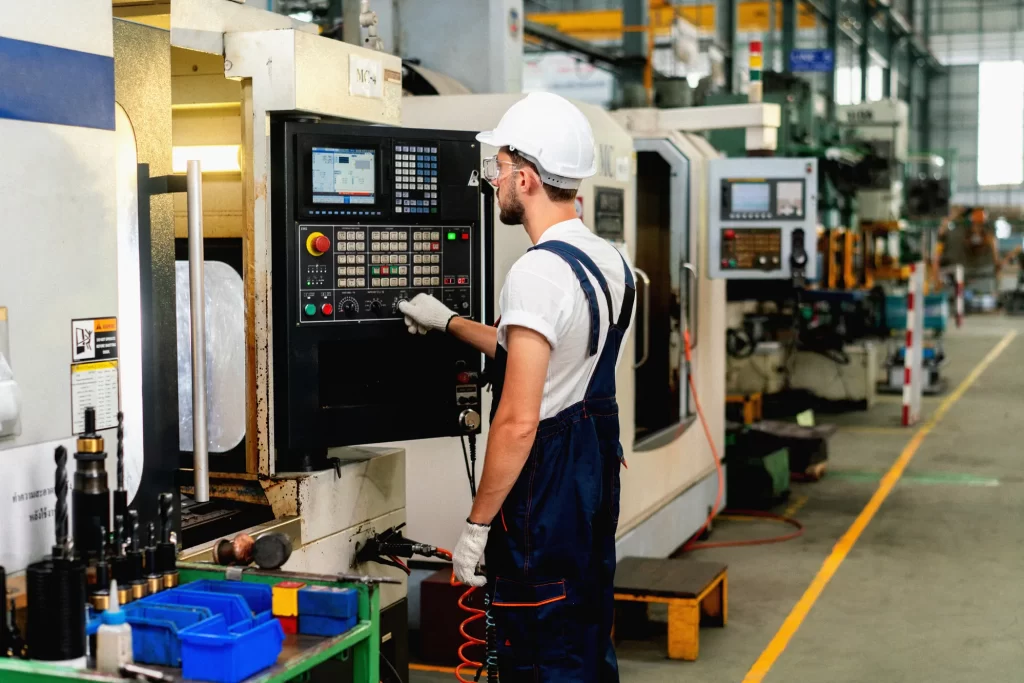 A worker is operating the machine